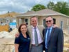 Habitat for Humanity of Hillsborough County CEO Tina Forcier expresses her appreciation to Rob Hendrickson of the county's Management and Budget Office and Jesse Coraggio, senior vice president of the Community Foundation of Tampa Bay.