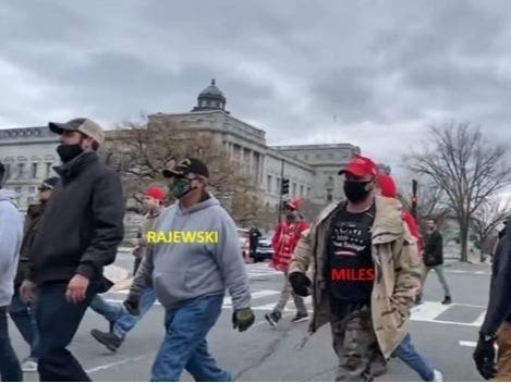 Steven Miles of Zephyrhills is seen marching with Dion Rajewski, 61, of Largo, to the Capitol building, according to the FBI. 