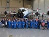 Hurricane hunters and other aircraft operations personnel stand in front of the WP-3D Orion "Kermit" in the hangar at the NOAA Aircraft Operations Center at Lakeland Linder International Airport. 