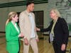 Tampa Mayor Jane Castor, who played basketball at Tampa University, and Ana Cruz greet Knox. 