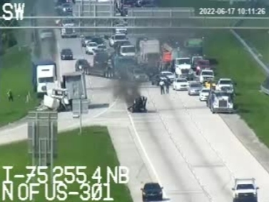 A crash Friday knocked some gas tanks off a tractor-trailer truck. They landed on a Buick Enclave driven by a Ruskin woman and carrying three other people. A 49-year-old Ruskin woman was killed, and the three others in the car were injured. 