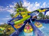 For the Rapid Racer, riders grab a two-person raft before racing through nearly 600 feet of slide, complete with low walls to encounter opponents throughout this side-by-side experience as guests swirl through high-speed tunnels and turns.