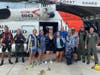 The Coast Guard rescued seven people Saturday after their 39-foot boat was struck by lightning 100 miles offshore of Clearwater.