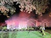The homeowner reported rescuing two of his three dogs, but the third was unaccounted for hours into the operation.