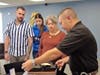 Tampa police Detective Mark Belmonte presents Officer William Krikava's service revolver to his survivors. 