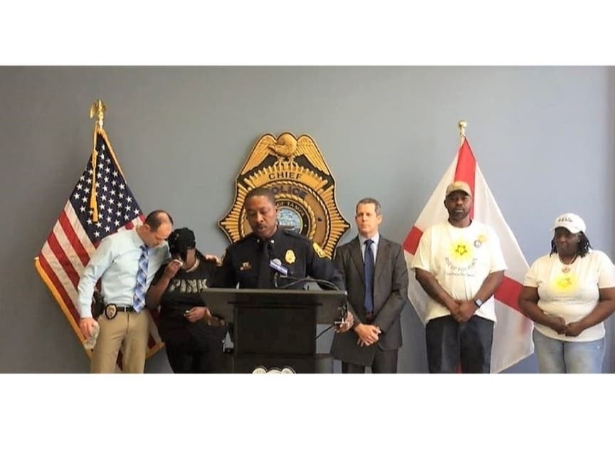 Sgt. Mike Lippold comforts Nilexia's mother, Ashley Alexander, as Tampa police Deputy Chief Calvin Johnson discusses Thursday's arrest. 
