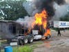 A semi-truck caught fire Sunday afternoon, spreading to a nearby mobile home in Tampa.