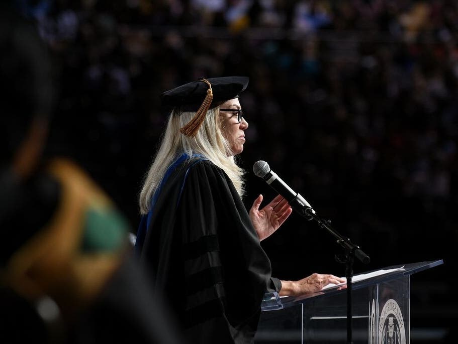 Retired Bloomin' Brands CEO Liz Smith speaks to graduates at HCC.