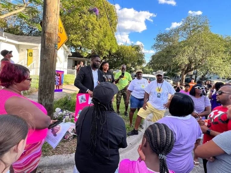 The community gathers for a vigil following the death of 14-year-old Nilexia Alexander. 