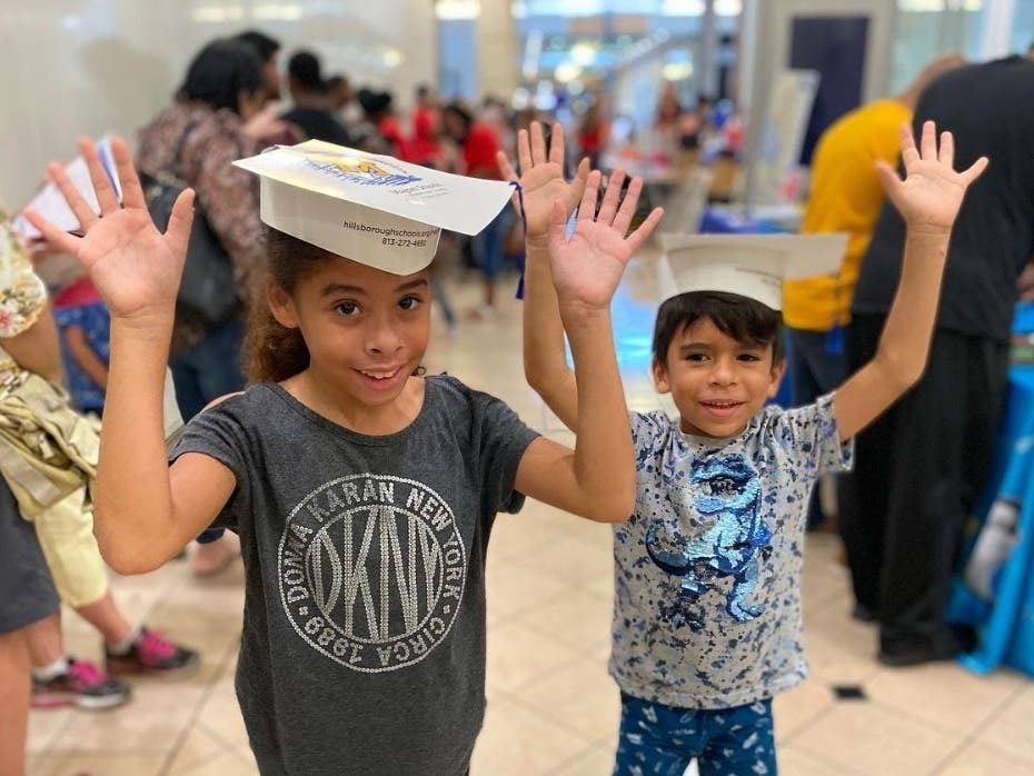 Students attend the back-to-school fair at Westshore Plaza July 30 to pick up free backpacks and school supplies. 