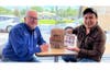 Hillsborough County Supervisor of Elections Craig Latimer enjoys a lunch break at McDonald's with a voter where owner Caspers Co. is including 80,000 "I Voted" stickers designed by Hillsborough County students in every bag. 