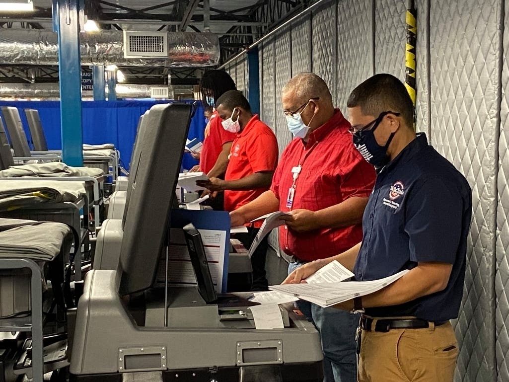 Hillsborough elections employees conduct a machine recount following the 2020 primary. 