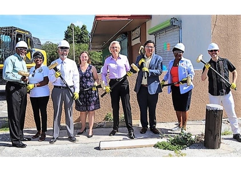 Mayor Jane Castor, members of the Tampa City Council and residents celebrate the demolition of the Penny Saver Food Market, which will make way for a new state-of-the-art recreation complex.