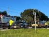 A 21-year-old Treasure Island woman was taken to the hospital with serious injuries after colliding with a school bus Monday morning.