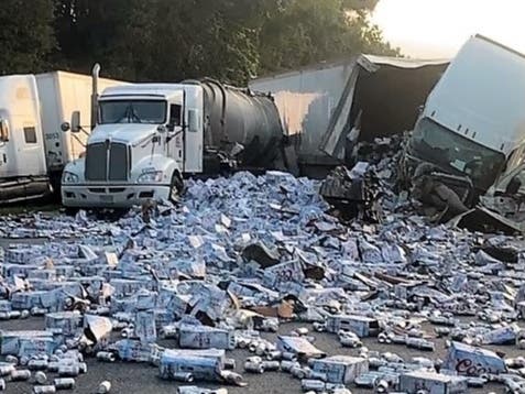 Cleanup crews were busy for more than two hours Wednesday morning when five semi trucks collided, causing one to dump its cargo of cases of Coors Lite.