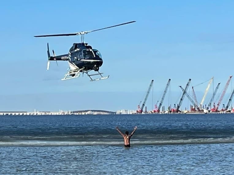 Tampa police aviation, marine and dive patrols helped catch a man accused of robbing a woman Saturday morning at a hotel on North Westshore Boulevard and then jumping into the bay to get away.