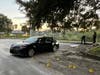 Police said more than a dozen shots were fired at the car before the shooter sped off, heading south on North Oregon Avenue.