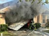 Hillsborough County Fire Rescue was called to a home at 9614 Laurel Ledge Drive Saturday at 4:18 and found heavy smoke and flames shooting from the garage. 