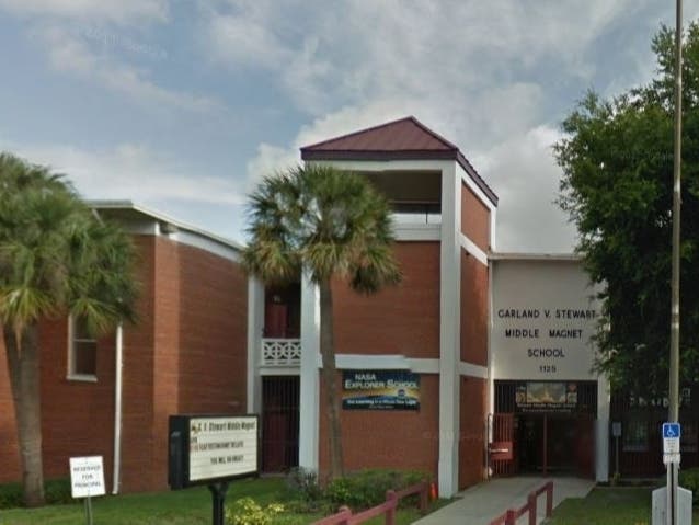 The 14-year-old girl was arrested after a parent noticed her carrying an electronic stun weapon at the school bus stop.
