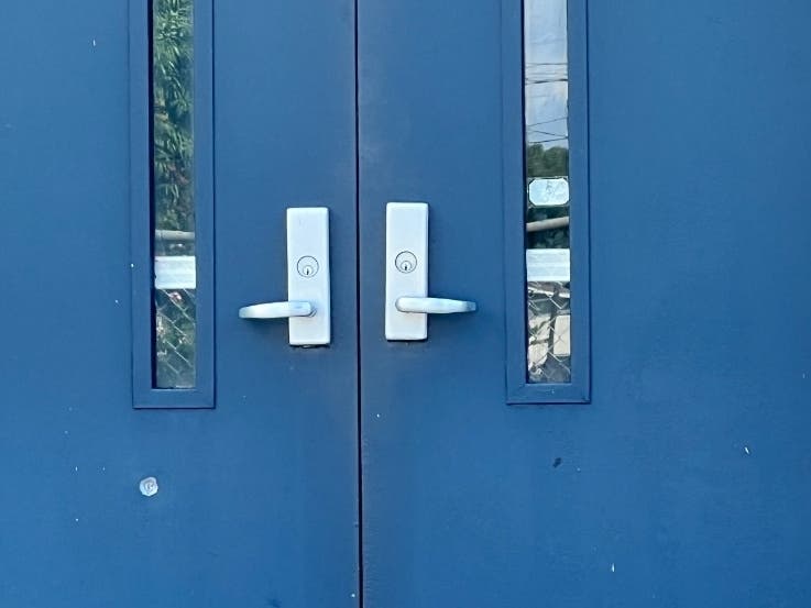 A photo provided by Tampa police shows where the bullet struck the exterior door of the school.