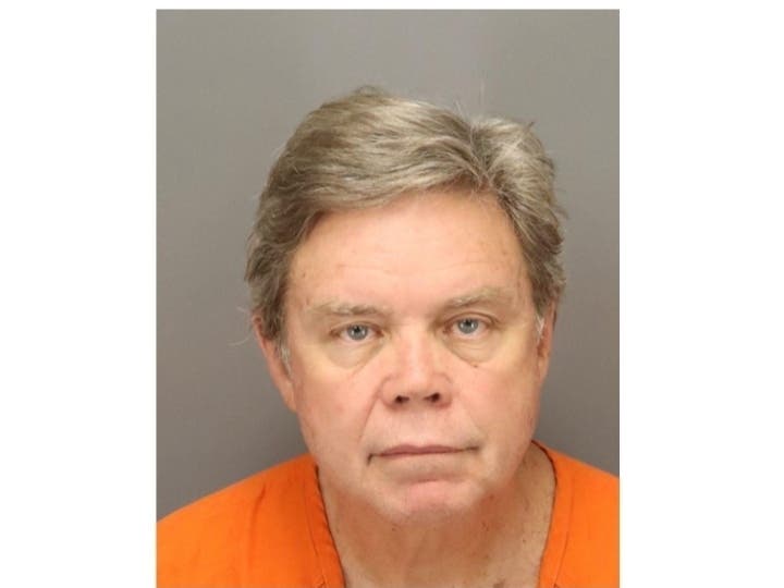 Michael Hugill was charged with 10 counts of possession of child pornography.