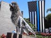 The artist used wreckage from Master Police Officer Jesse Madsen's police vehicle as well as 125 de-commissioned guns to create the memorial sculpture.
