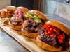 Mighty Quinn's serves a selection of sandwiches include pulled pork, burnt ends and crispy chicken sandwiches.