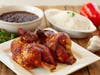 La Granja's famous chicken dishes are offered in whole, half and quarter sizes and come with rice or beans. 