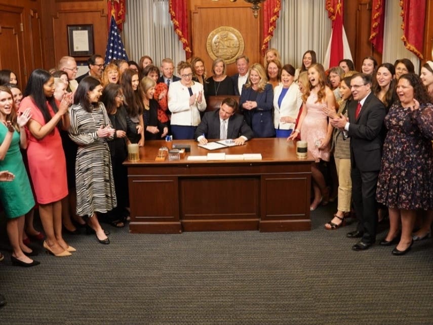 Opting not to hold a press conference, Gov. Ron DeSantis signed the six-week abortion ban into law surrounded by supporters Thursday. 