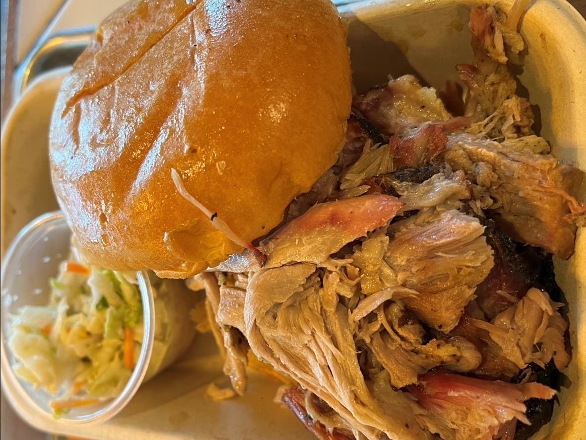 The pulled pork sandwich was overflowing with moist, smoky meat.