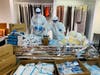 Healthyline workers shown donating vital supplies to front line healthcare workers