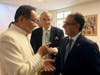 Dr. Hong, Tao-Tze, President of FOWPAL, left, and Ambassador Yusuf Abdulkarim Bucheeri of Bahrain to the UN (Vienna), exchange ideas about celebrating the United Nations' designation of April 5 as the International Day of Conscience. (AP Images)