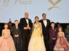 Herta Margarete Habsburg-Lothringen, president of the Flame of Peace, center, together with Sandor Habsburg-Lothringen, vice president of the Flame of Peace, right, presents the Flame of Peace Award to Prince Albert II of Monaco, left.