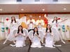 Dr. Hong, Tao-Tze, Prime Minister Briceño, and FOWPAL members dressed as angels pose for a group photo.

