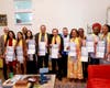 Dr. Hong, Tao-Tze, President of FOWPAL, center, presents “Conscience Maxim Bookmarks” to leaders in Port of Spain, Trinidad and Tobago, encouraging everyone to follow their conscience and uphold transparency and integrity.
