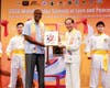 H.E. Lynn Raymond Young, former Ambassador of Belize to the United States, receives an artwork from the treasured collection of the Hong Tao Tze Foundation following ringing the Bell of World Peace and Love.
