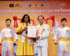 H.E. Dr. Candice A. Pitts, City Administrator for Belize City and former Ambassador of Belize to Japan, receives a certificate of honor following ringing the Bell of World Peace and Love.
