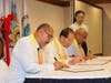 Dr. Hong, Tao-Tze, center, Belizean Minister of State Ramirez, left, and Belize City Mayor Wagner formally endorse the Declaration of Transparency and Integrity, underscoring the importance of these principles in ethical governance and global peace.
