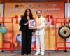 Patricia McDougall receives the Bridge-Builder Award for Love and Peace in recognition of her efforts to promote transparency, integrity, and unity.
