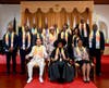 From left, Dr. Hong, Tao-Tze; H.E. Dame Cynthia A. Pratt, Governor-General of The Bahamas; and H.E. Ann Marie Davis, First Lady of The Bahamas, pose for a group photo with the bell ringers and recipients of Compass Clock of Conscience.

