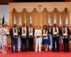 Dr. Hong, Tao-Tze, President of FOWPAL, center, presents the “Key to the Heart” to each of the bell ringers. The key symbolizes that conscience is the key to unlocking a peaceful and sustainable future for humanity.
