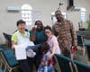 Attendees pose for a group photo with FOWPAL members after endorsing the Declaration of Transparency and Integrity.
