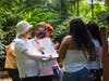 FOWPAL members invite the public to endorse the Declaration of Transparency and Integrity, promoting global peace and sustainability, and are met with warm smiles from Belizeans.
