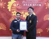 Abel Casanova, representing California State Assemblywoman Blanca E. Rubio, presents a certificate of recognition to Tai Ji Men Qigong Academy, thanking the organization for its continued dedication and service to the community. 