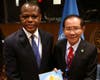 Dr. Hong presents to Ambassador Samuel Yao Kumah two books highlighting the key collaborations between FOWPAL and various permanent missions to the UN that led to the UN’s adoption of the International Day of Conscience and International Day of Hope. 

