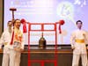 Dr. Hong, Tao-Tze, President of the Federation of World Peace and Love (FOWPAL), rings the Bell of World Peace and Love in Belfast, Northern Ireland, conveying blessings of peace and harmony.
