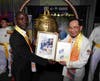 Dr. Hong presents a painting from the treasured collection of the Hong Tao Tze Foundation to Daniel Kokoi Jr., Assistant Minister for International Organizations of Liberia, who rang the Bell on behalf of President Joseph Boakai of Liberia.