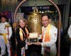 Dr. Hong, right, presents Mildred G.M. Schwengle, Minister Plenipotentiary of Aruba to the Netherlands, with the symbolic "Key to the Heart" after she rang the Bell of World Peace and Love.