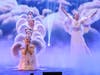 Dressed in elegant angel costumes, practitioners from Tai Ji Men Qigong Academy convey messages of love, hope, and compassion.