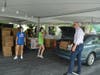 Orland Township Supervisor Paul O'Grady helps volunteers load cars during a previous grocery distribution event held at the Township.